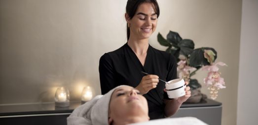 young-woman-using-face-treatment-her-client
